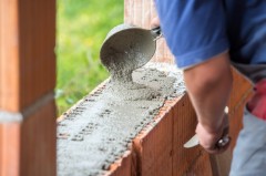 gallery/man-hand-building-wall-bricks_21730-12129